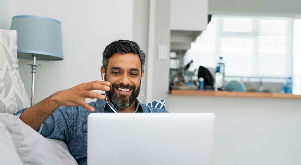 man-on-video-call-on-laptop